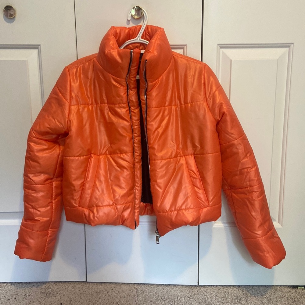 Neon orange puffer jacket